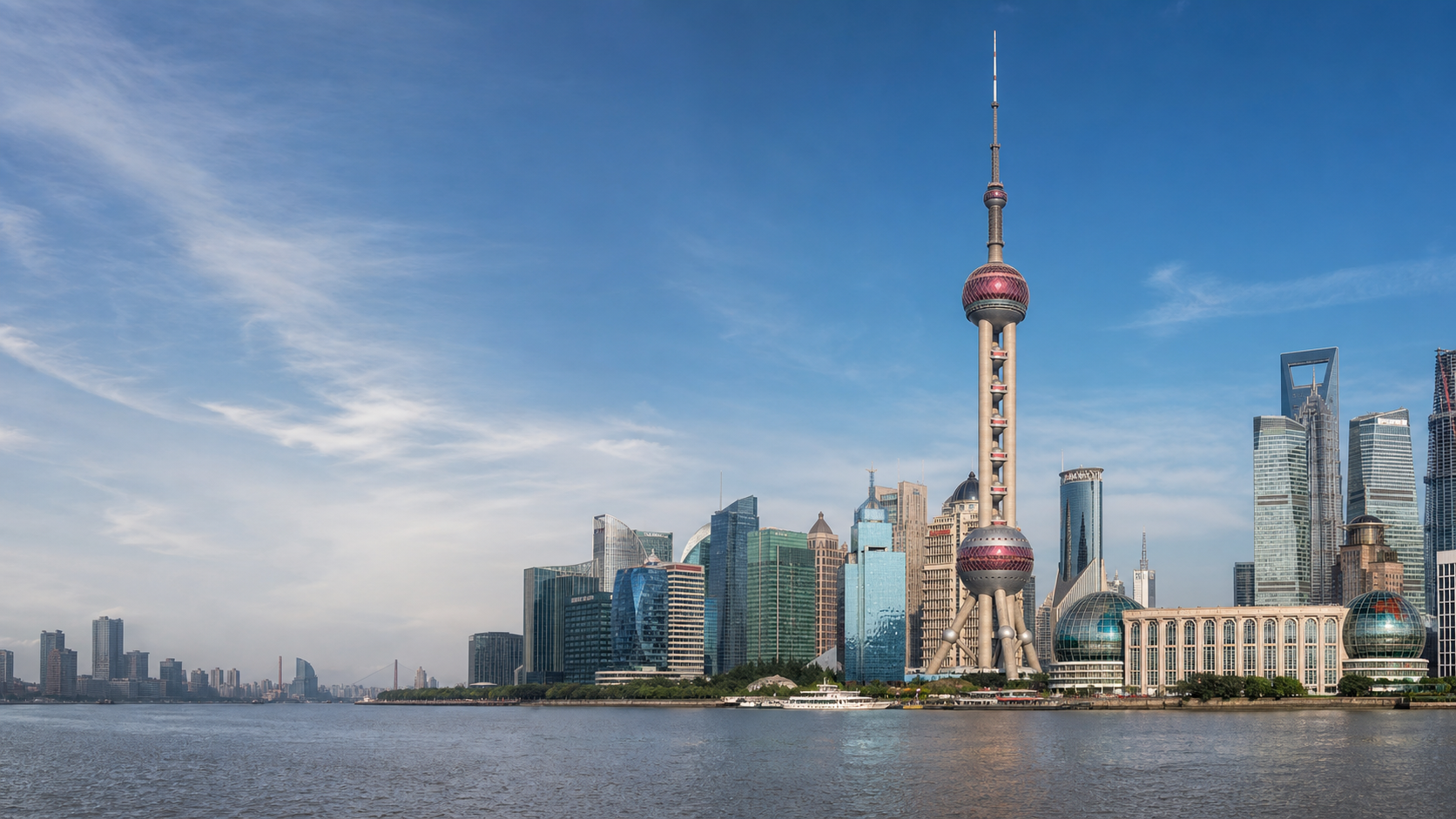 Shanghai skyline across the Huangpu River with the Oriental Pearl Tower